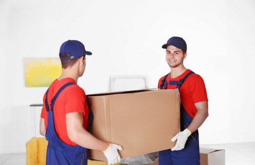 Professional movers packing items in Chiswick home