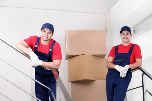 Experienced movers handling furniture disassembly in Chiswick