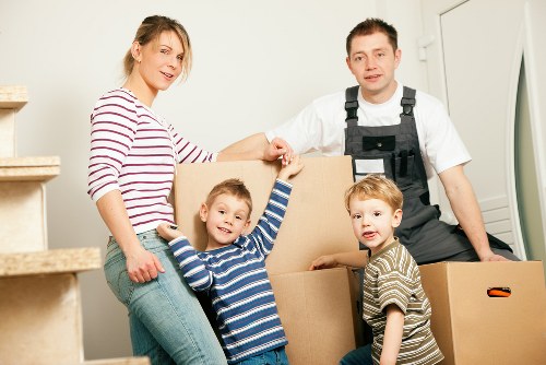 Professional movers securing items in a removal truck